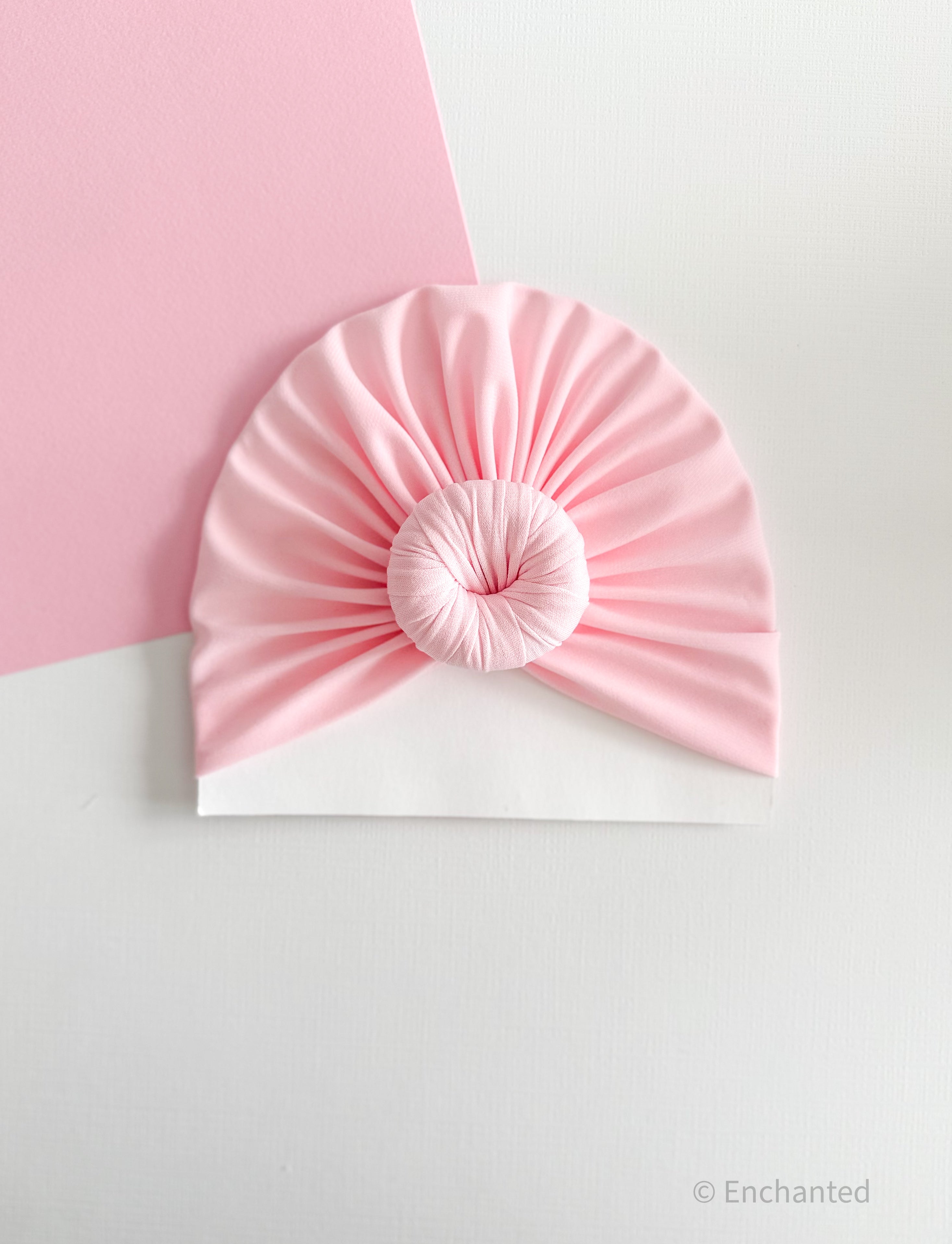 Turbante de nudo rosa bebé